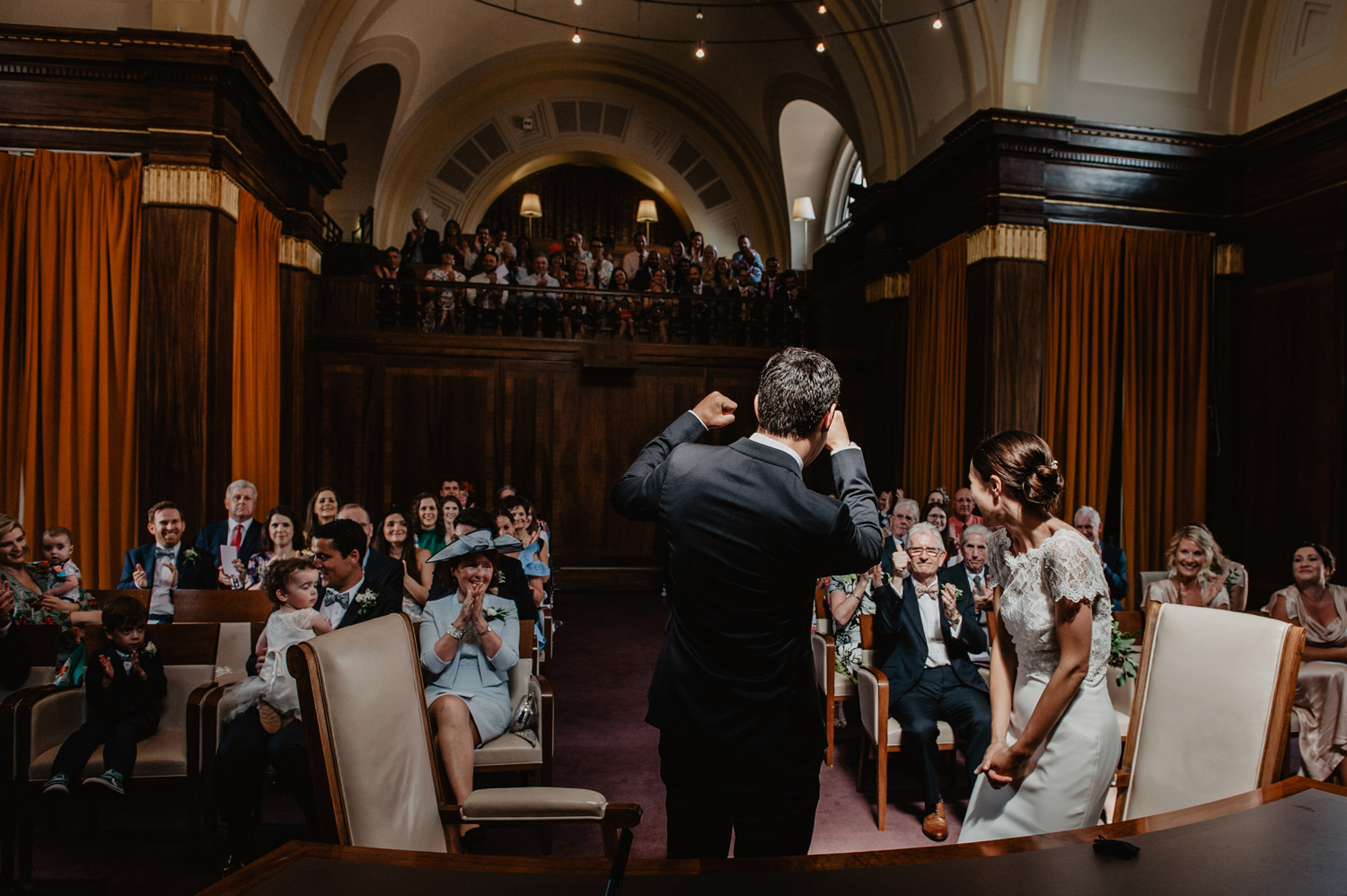 stoke newington town hall wedding bride groom first kiss