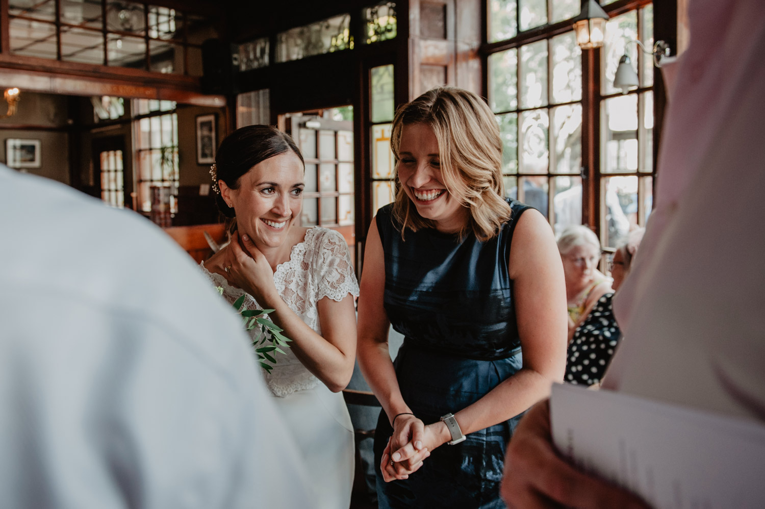 boho wedding bride laughing at rose and crown pub wedding stoke newington