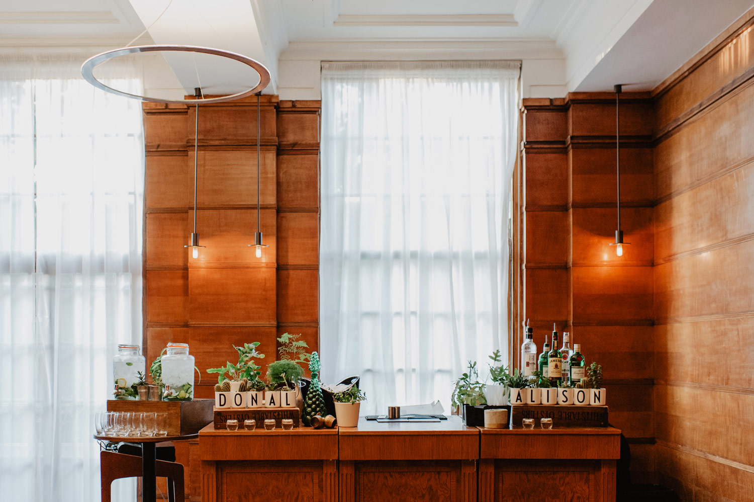 london town hall hotel wedding midcentury modern bar with cacti and succulents