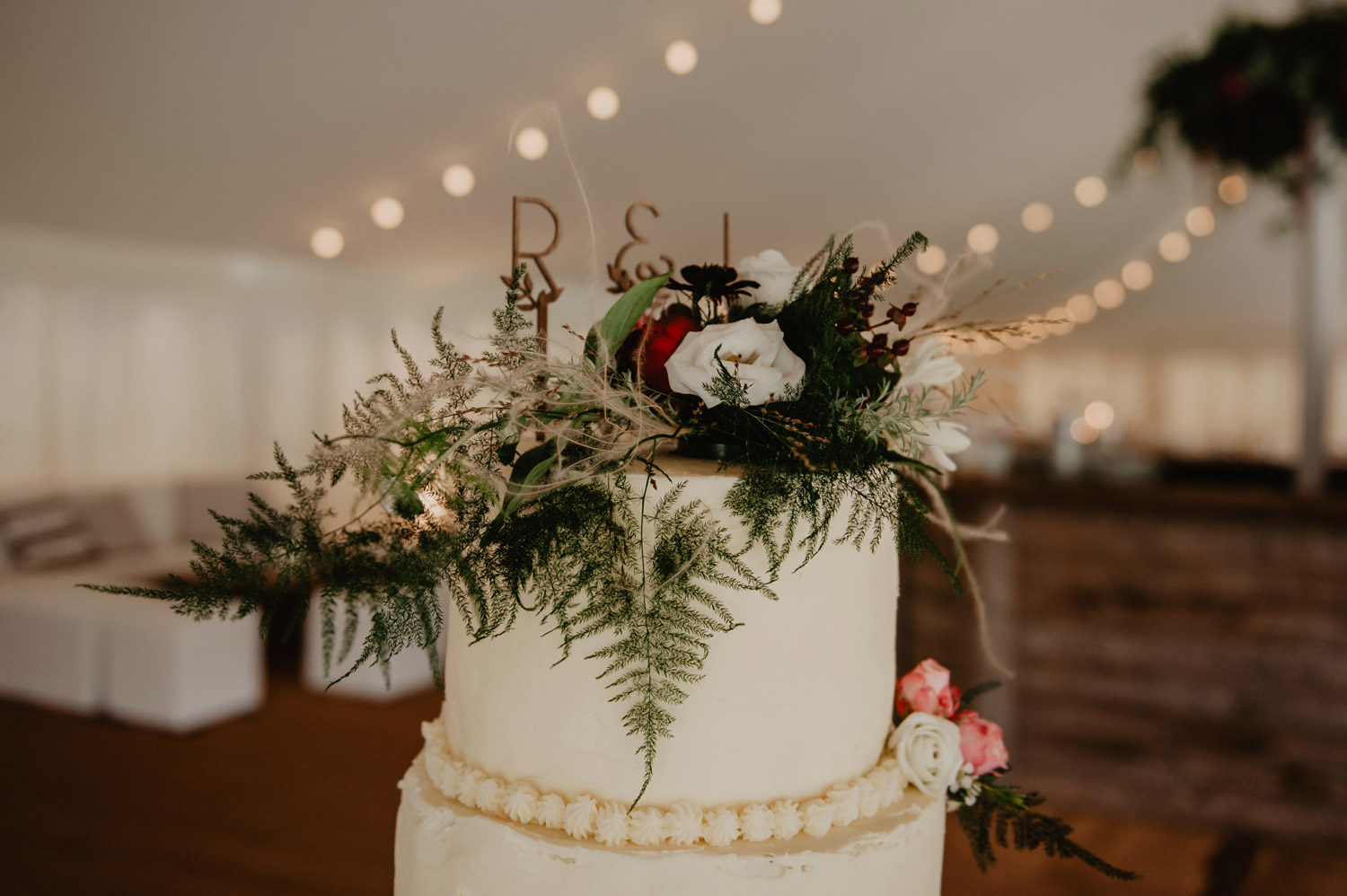 fern greenery decorated tiered wedding cake