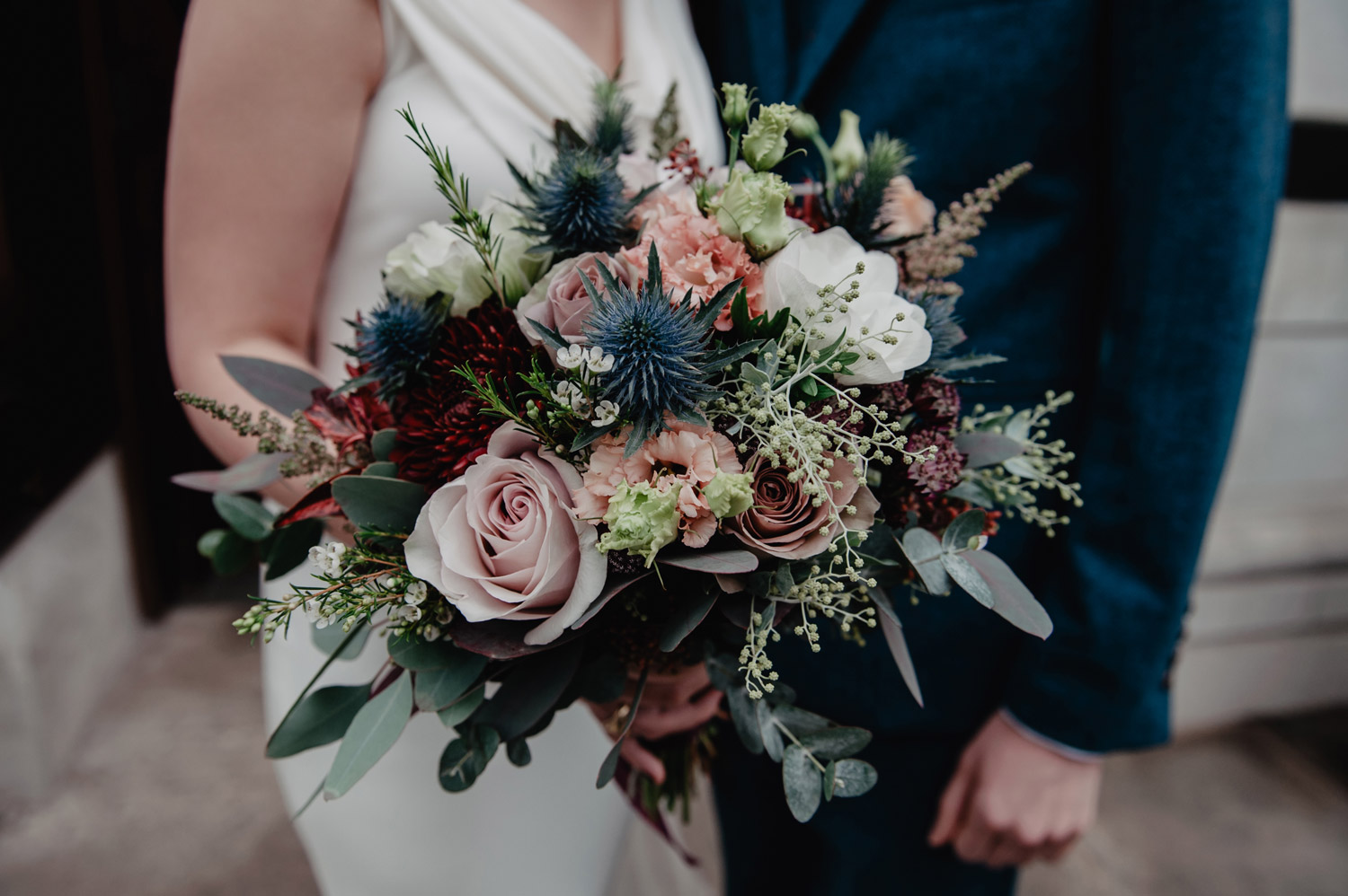 winter wedding bouquet thistles roses