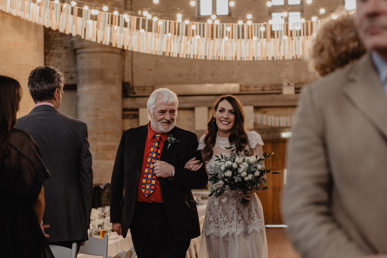 father walking bride down aisle cathedral