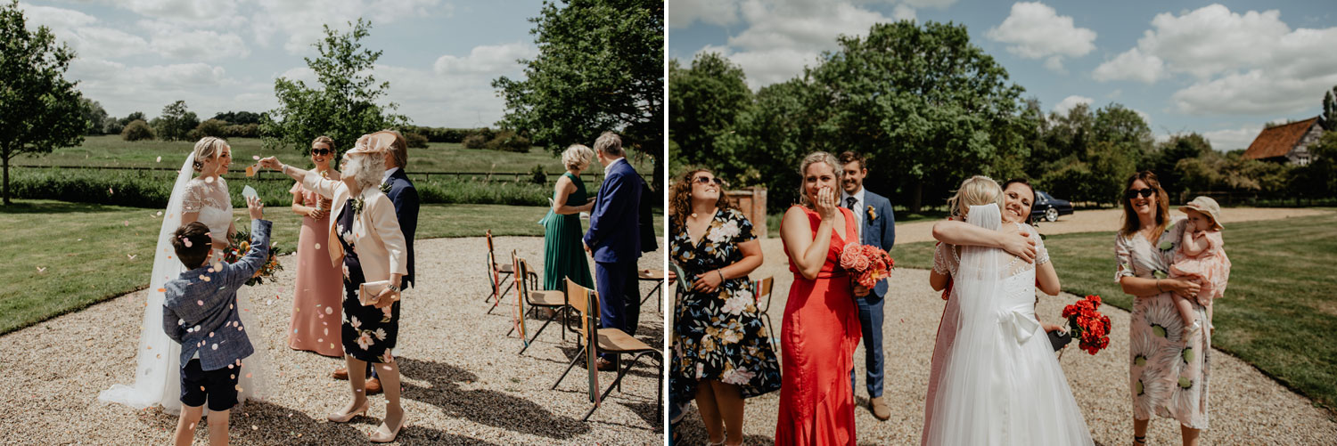 abbey hall eye suffolk wedding smiling bride walking down the aisle carrying a pink peony bouquet by anne schwarz photography