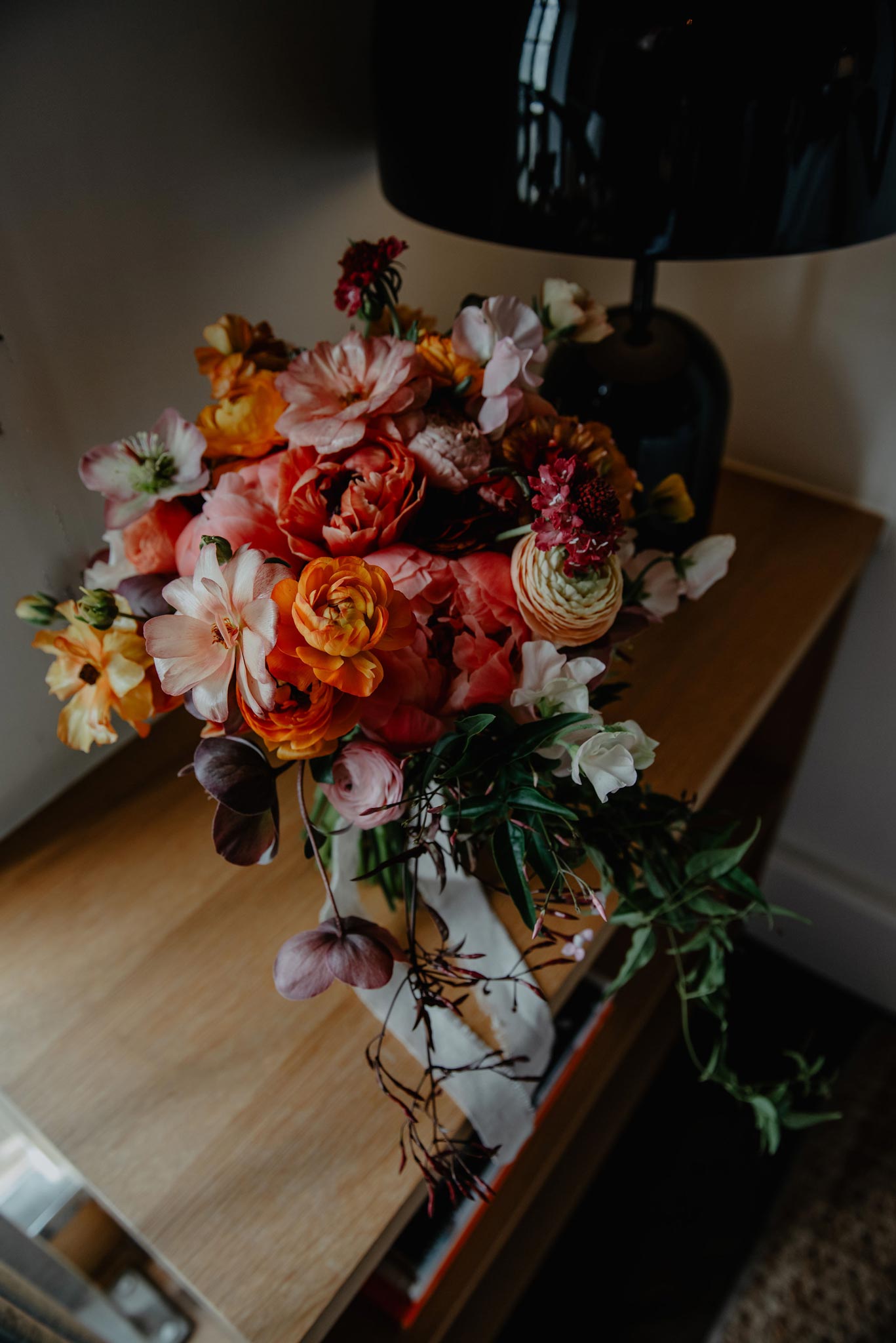 bridal bouquet with peach and orange ranunculus at one hundred shoreditch hotel