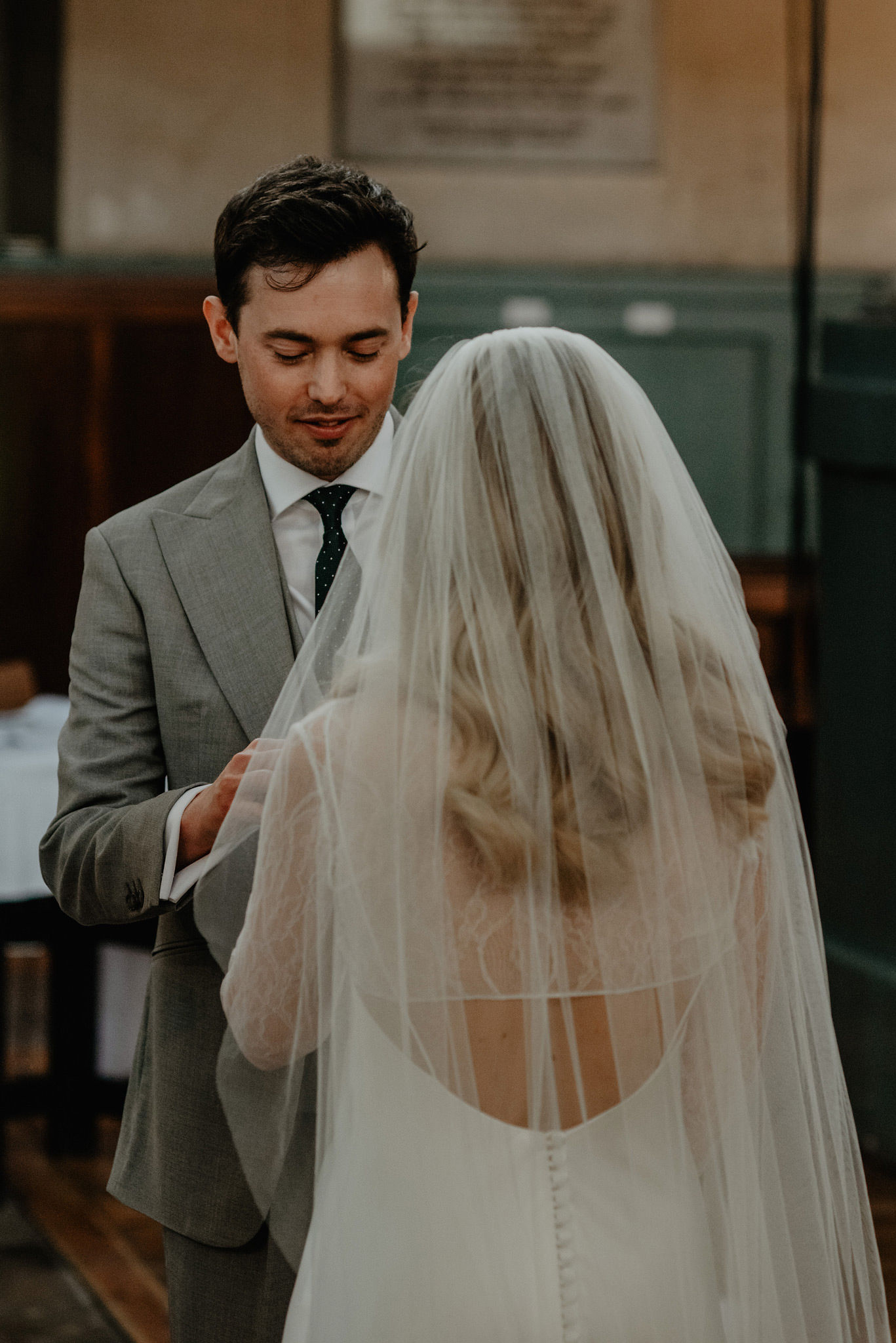 ring exchange during modern colourful wedding at shoreditch church and studios by anne schwarz photography