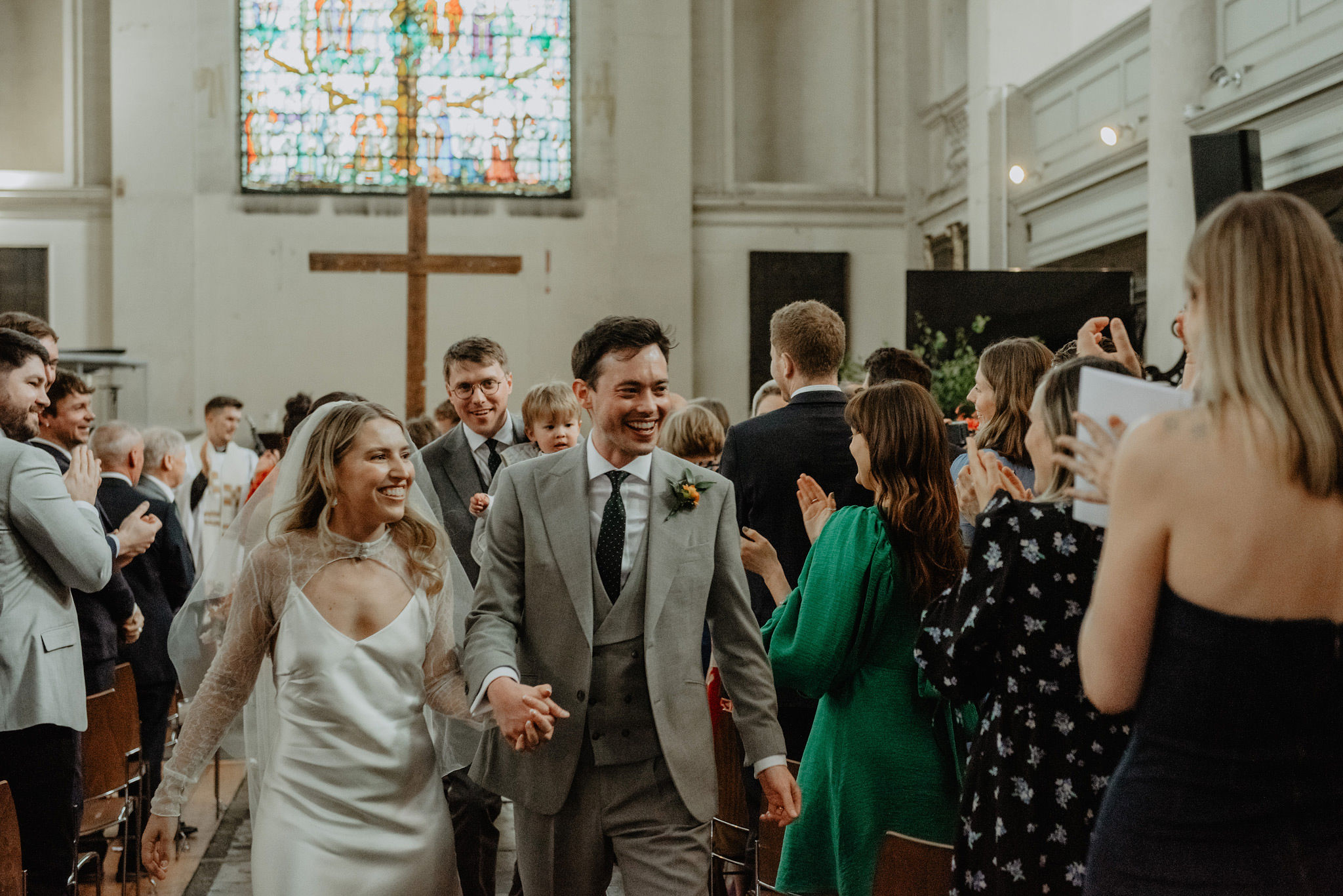 bride and groom walking aisle after wedding service at shoreditch church