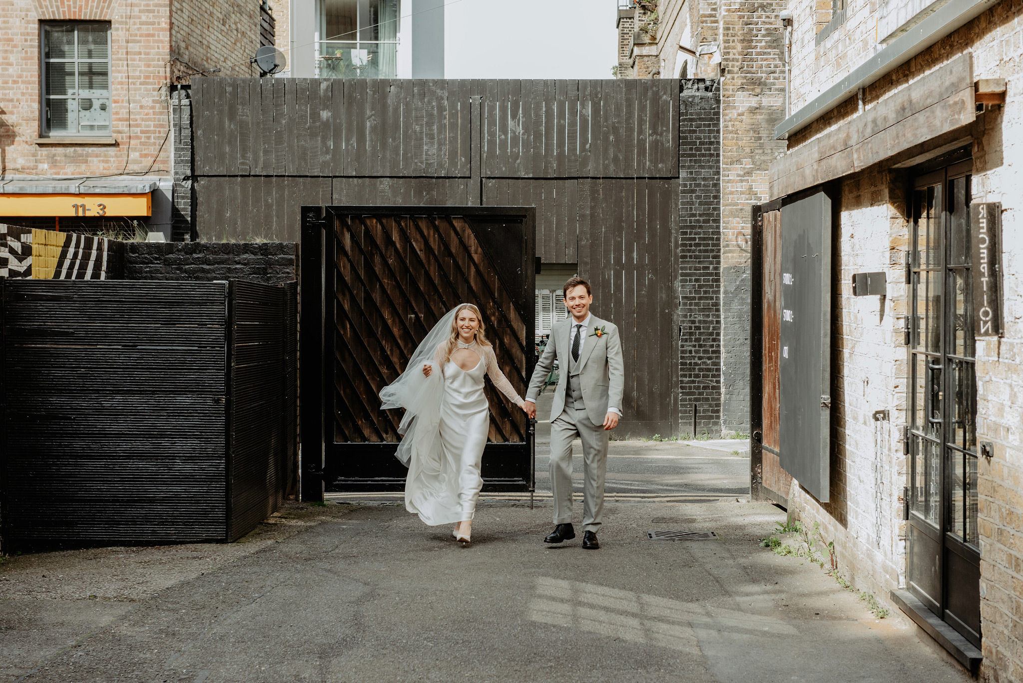 couple arriving at wedding venue shoreditch studios hackney london