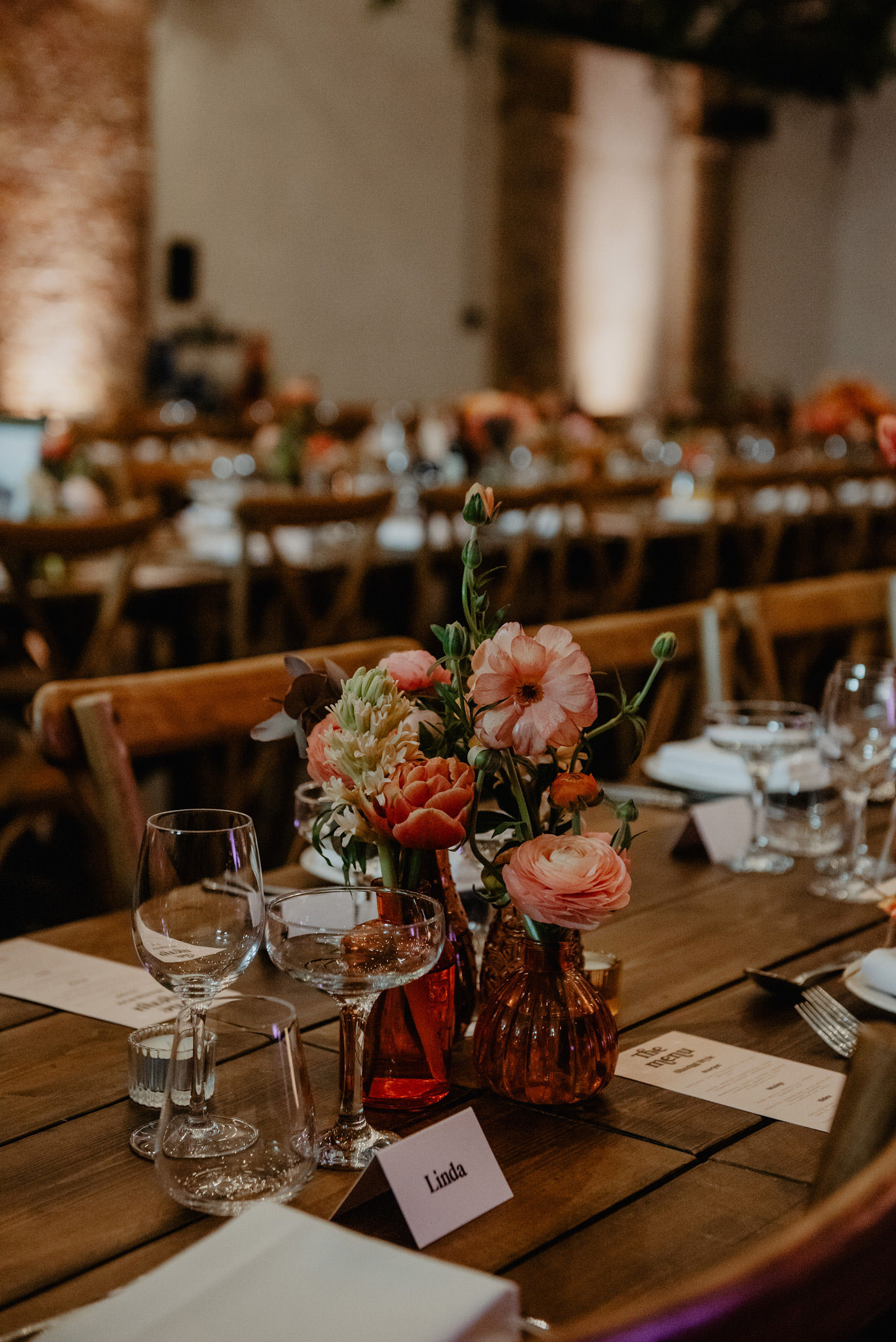 colour pop butterfly ranunculus bud vase wedding table at shoreditch studios wedding photography