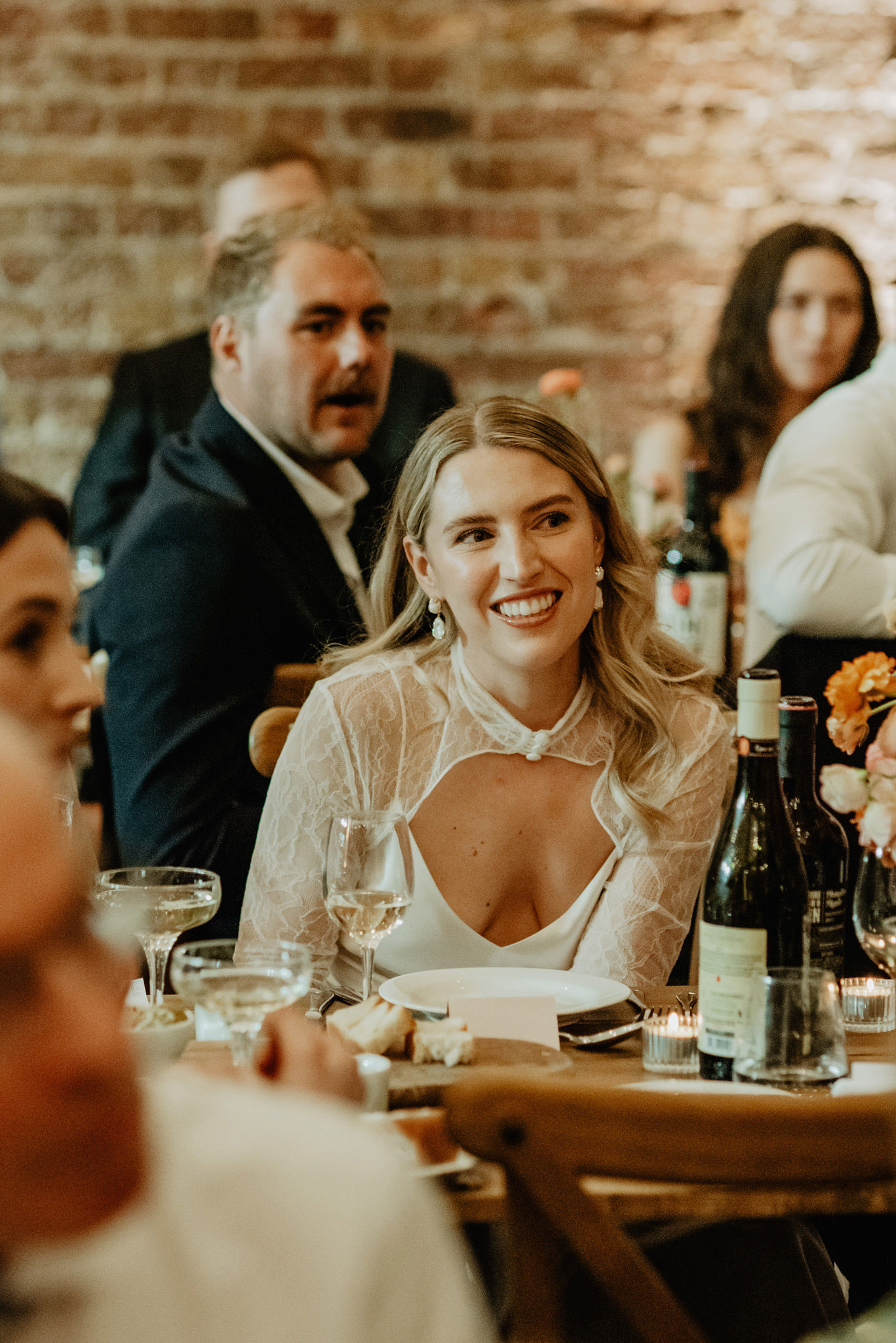 bride smiling during speech at relaxed shoreditch studios wedding photography