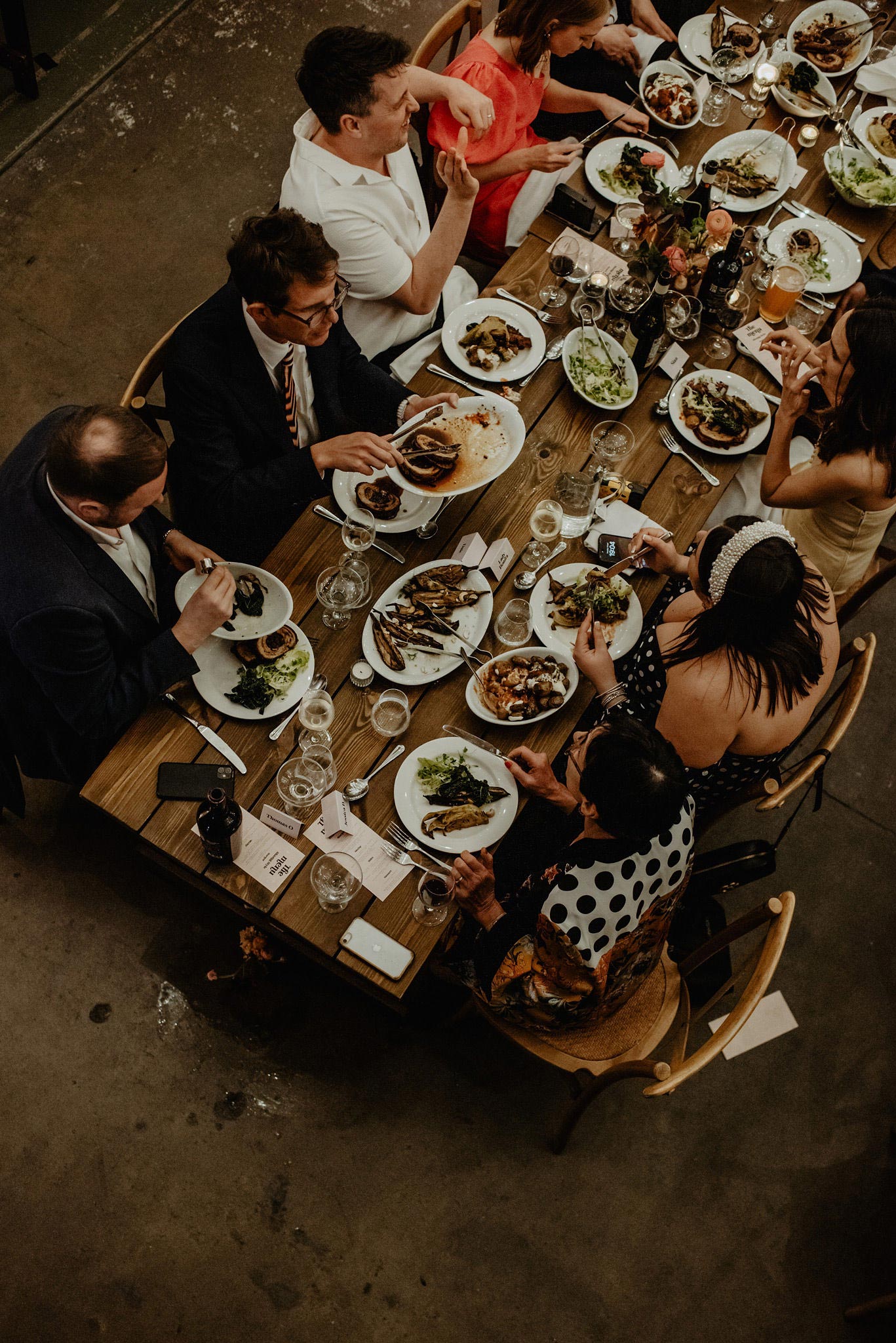 overhead photo of family style wedding dinner at reception at shoreditch studios